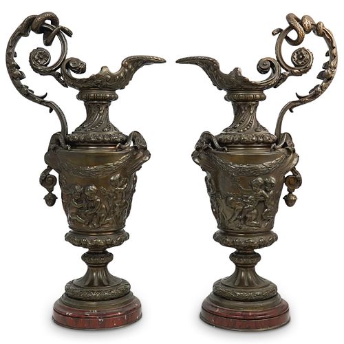 Pair of Bronze Figural Ewers