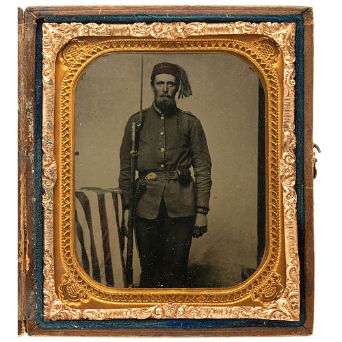 [CIVIL WAR]. Sixth plate tintype of armed Zouave posed beside American flag. N.p.: n.p., [1860s].
