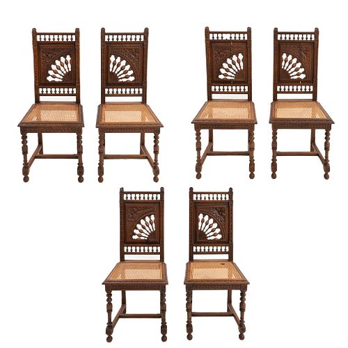 Lote de 6 sillas. Francia. SXX. Estilo Bretón. En talla de madera de roble. Con respaldos semiabiertos y asientos de bejuco.