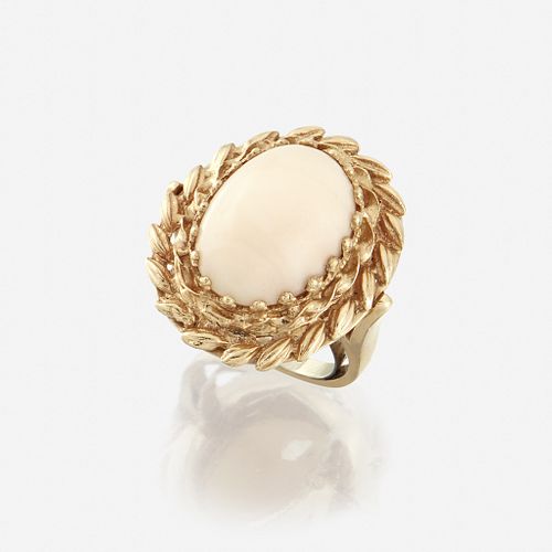 A coral and fourteen karat gold ring