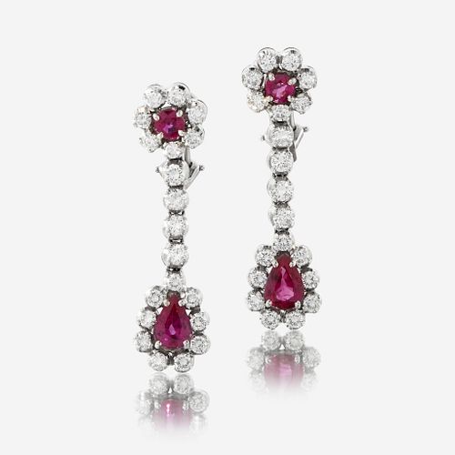 A pair of diamond, ruby, and fourteen karat white gold earrings