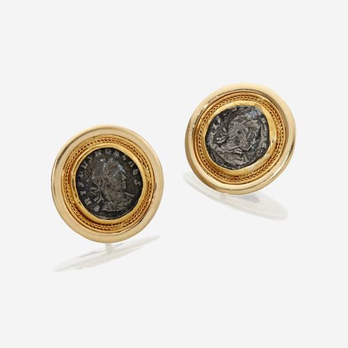 A pair of fourteen karat gold and coin earclips
