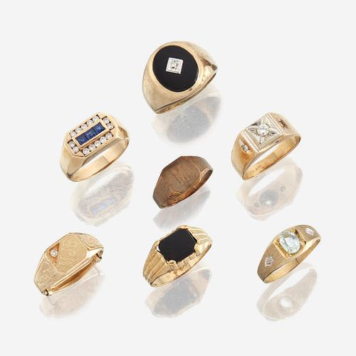 A collection of seven gold rings