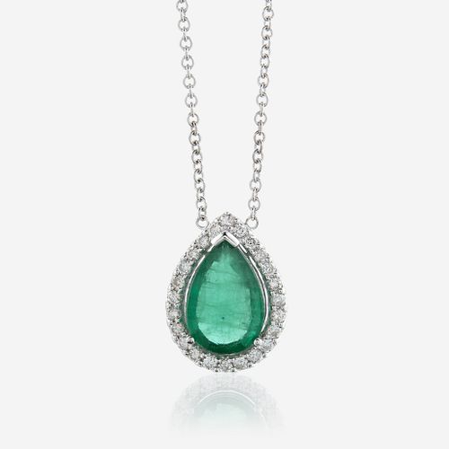 An emerald, diamond, and eighteen karat white gold pendant with chain