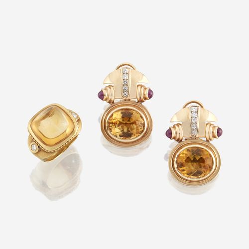 A pair of citrine and gold ear clips with similar ring