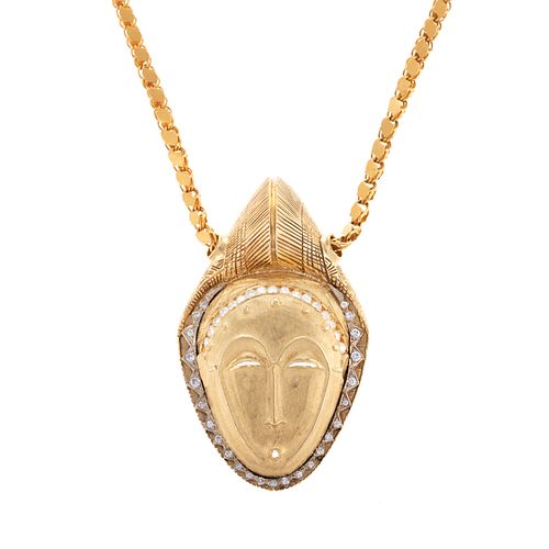 A Substantial 18K Mask with Diamonds on Chain