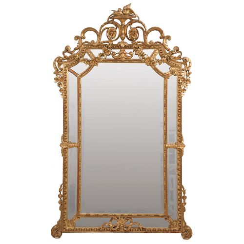 MIRROR FRANCE, 19TH CENTURY Made of gilded wood with a beveled moon. Decorated with acanthus scrolls. 70.8 x 43.3" (180 x 110 cm)