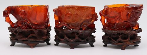Grouping of (3) Carved Amber Water Coupes.