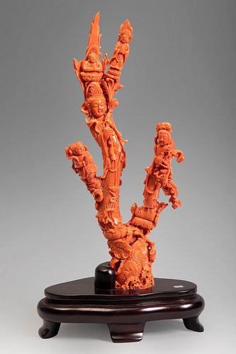 Buddhist group with Kuan Kin. China, 20th century.
In coral with three branches.
Wooden base.
