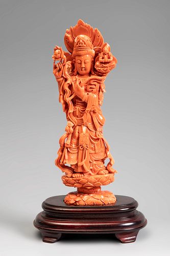 Guanyin from Southeast Asia, 20th century.
Coral.
Wooden base