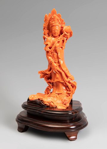 Guanyin. China, 20th century.
Coral.
With wooden base.