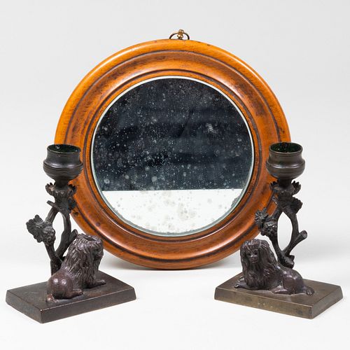 Pair of Small Bronze Lion Form Candlesticks and a Fruitwood Circular Mirror