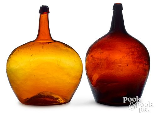 Two amber glass demijohns, 19" h.