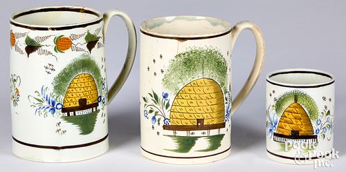 Three pearlware mugs, 19th c., with beehive decora