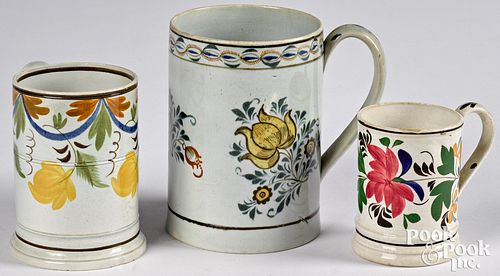 Three pearlware mugs, 19th c., with floral decorat