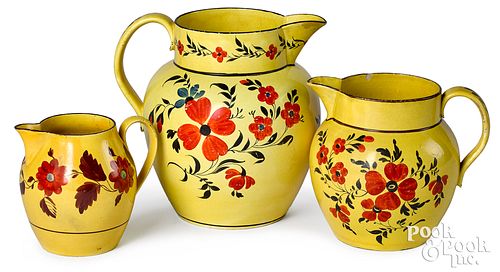 Three Staffordshire canary pitchers, 19th c.