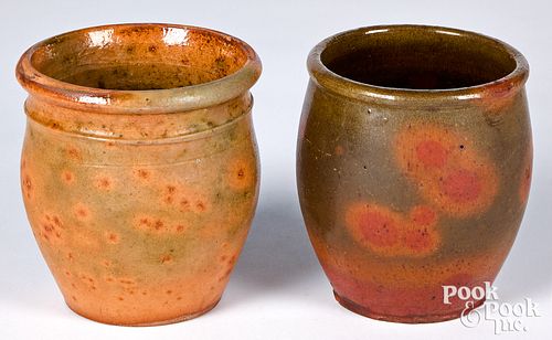Two Pennsylvania redware crocks, 19th c., with spe