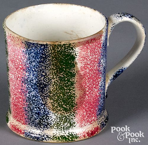 Green, red, and blue rainbow spatter mug