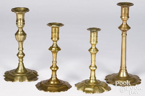 Four Queen Anne scalloped base candlesticks, mid 1