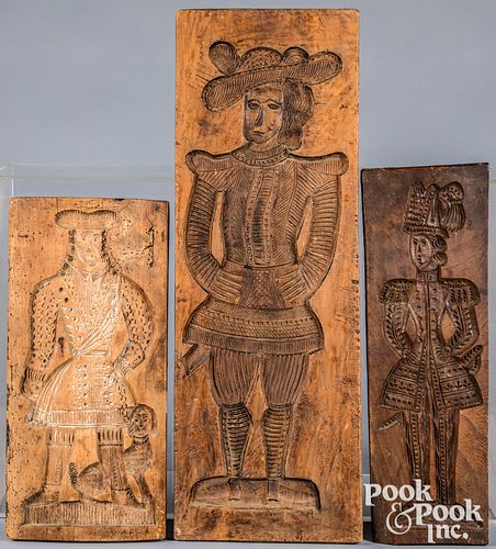 Three Dutch carved cakeboards, 19th c., with figur
