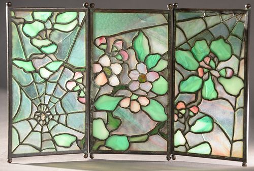 Tiffany Studios "Spider" Tea Screen, having three leaded glass panels with patinated bronze having apple blossom with spider web on ball feet, height 