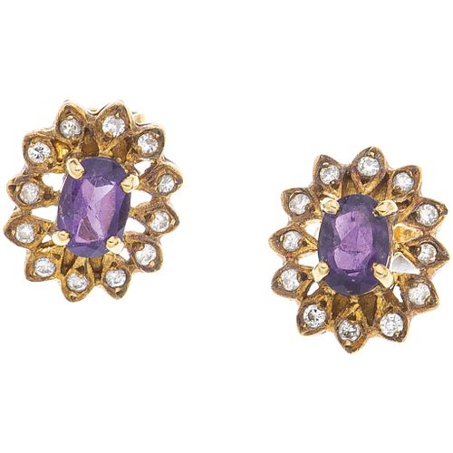PAIR OF STUD EARRINGS WITH AMETHYSTS AND DIAMONDS IN 14K YELLOW GOLD Oval cut amethysts ~0.80 ct, Brilliant cut diamonds ~0.20ct