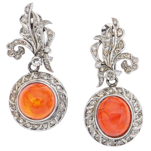 EARRINGS WITH OPALS AND DIAMONDS IN PALLADIUM SILVER Cabochon cut fire opals, 8x8 and Swiss cut diamonds ~0.70 ct. Weight: 11.5 g