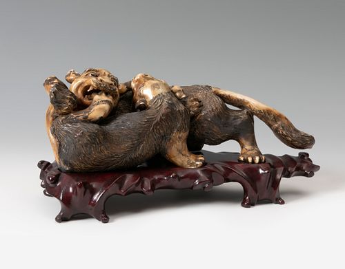 Beasts. China, 19th century. Ivory polychrome. Base in carved wood. Signed at the base.