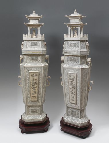 Pair of pagodas. China, second half of the 20th century. Carved ivory. Lower structure with a wooden core.