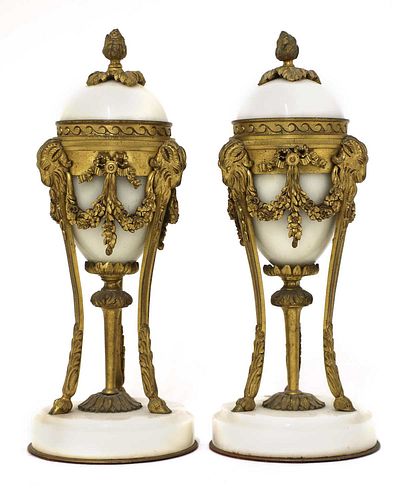 A pair of French Empire-style white marble and ormolu cassolettes,