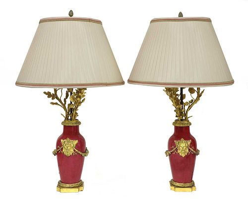 A pair of ormolu-mounted pink ground vase lamps,