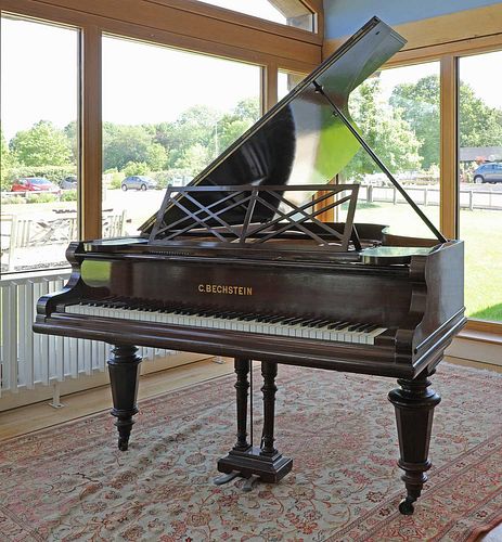 A Victorian mahogany baby grand piano by Bechstein,