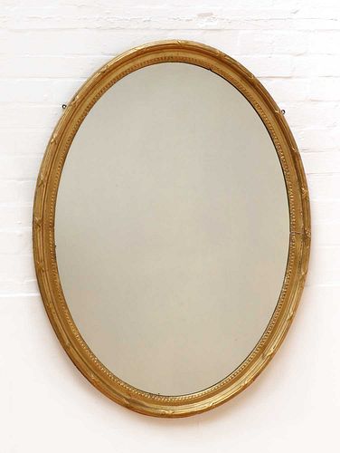 A George III-style oval wall mirror,