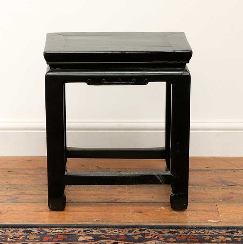 A Chinese black lacquer stool,