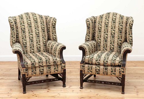 A pair of George III-style mahogany wingback armchairs