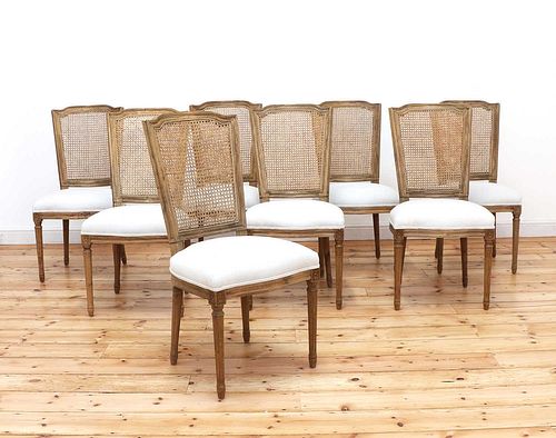 A set of eight modern bleached oak dining chairs,