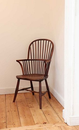 A yew and elm high hoop back Windsor chair,
