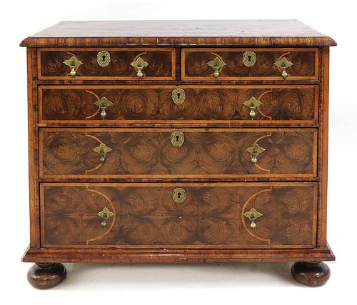 A William and Mary oyster veneered laburnum and fruitwood inlaid chest of drawers