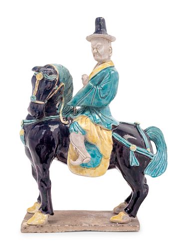 A Chinese Purple, Yellow and Blue Glazed Porcelain Equestrian Figure