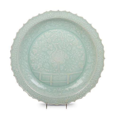 A Chinese Molded Celadon Glazed Porcelain Charger
