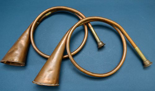Two Copper Hunting Horns