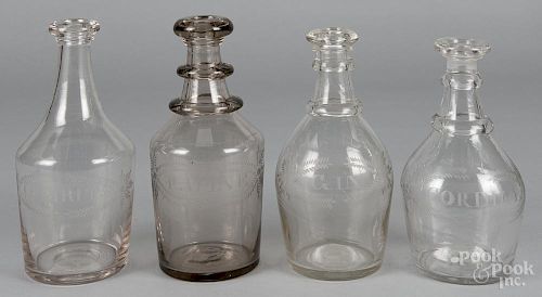 Four etched flint glass liquor bottles, inscribed Gin, Cordial, J. Spirits, and P. Wine