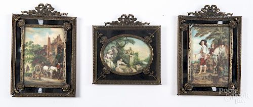 Three miniature printed works housed in chased brass frames