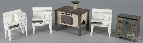 Tin dollhouse furniture, 20th c., to include three matching kitchenettes, a stove