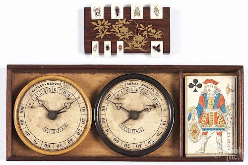 French game set, early 20th c., to include two Cadran-Marque score keepers and a set of cards