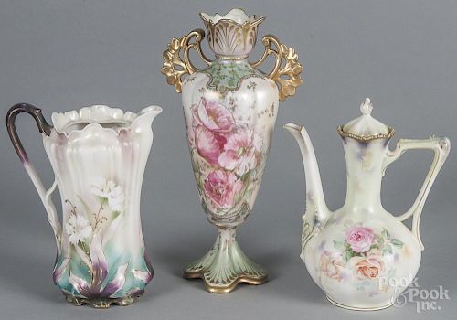 R. S. Prussia porcelain rose teapot, ca. 1900, 9 1/4'' h., together with a floral chocolate pot