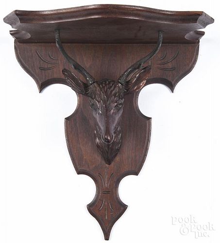 German carved walnut black forest shelf, ca. 1900, with a stag head support, 13'' h., 12'' w.