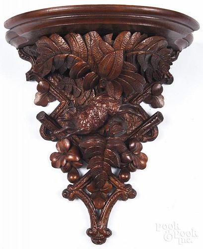 German carved walnut black forest shelf, ca. 1900, with a running fox and foliate support, 15'' h.