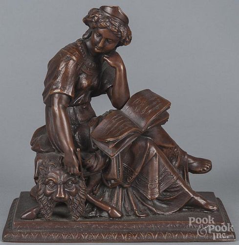 Bronzed spelter mantel garniture, ca. 1900, of a seated woman writing in a book, 9 1/2'' h., 9 1/2'' w.