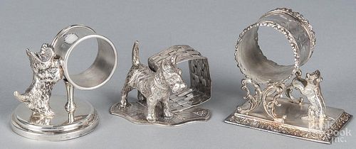 Three silver-plate figural napkin rings, early 20th c., with dogs, tallest - 3 1/4''.
